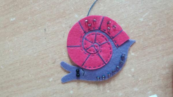 Brooch made of felt snail. Master Class.